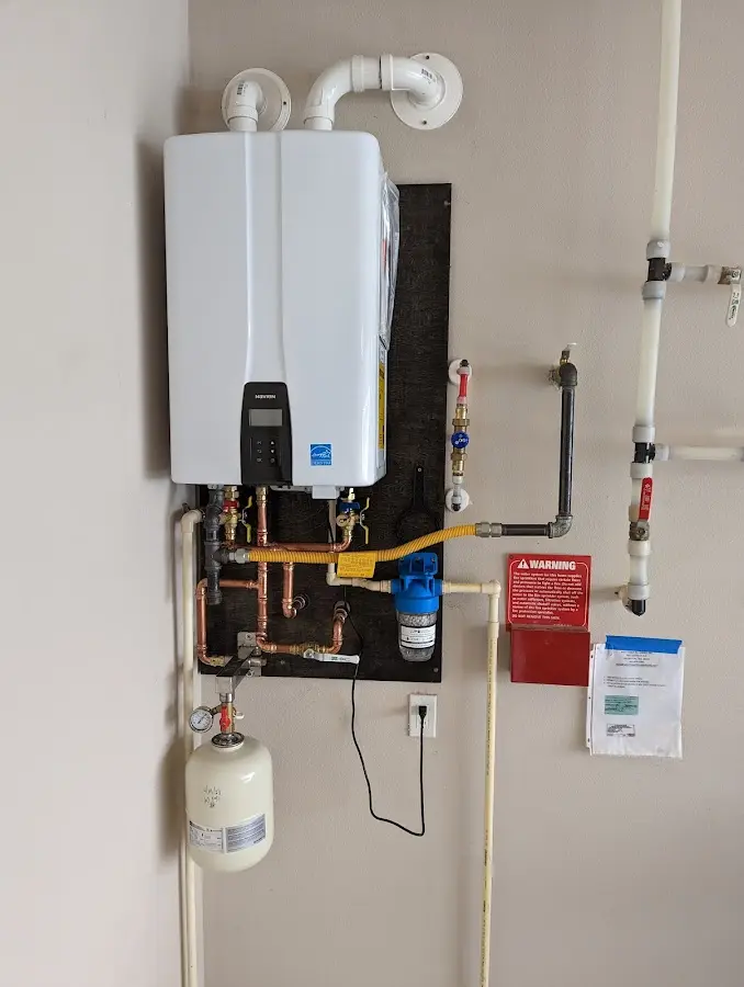 Professional plumber installing copper piping in a Williamstown home